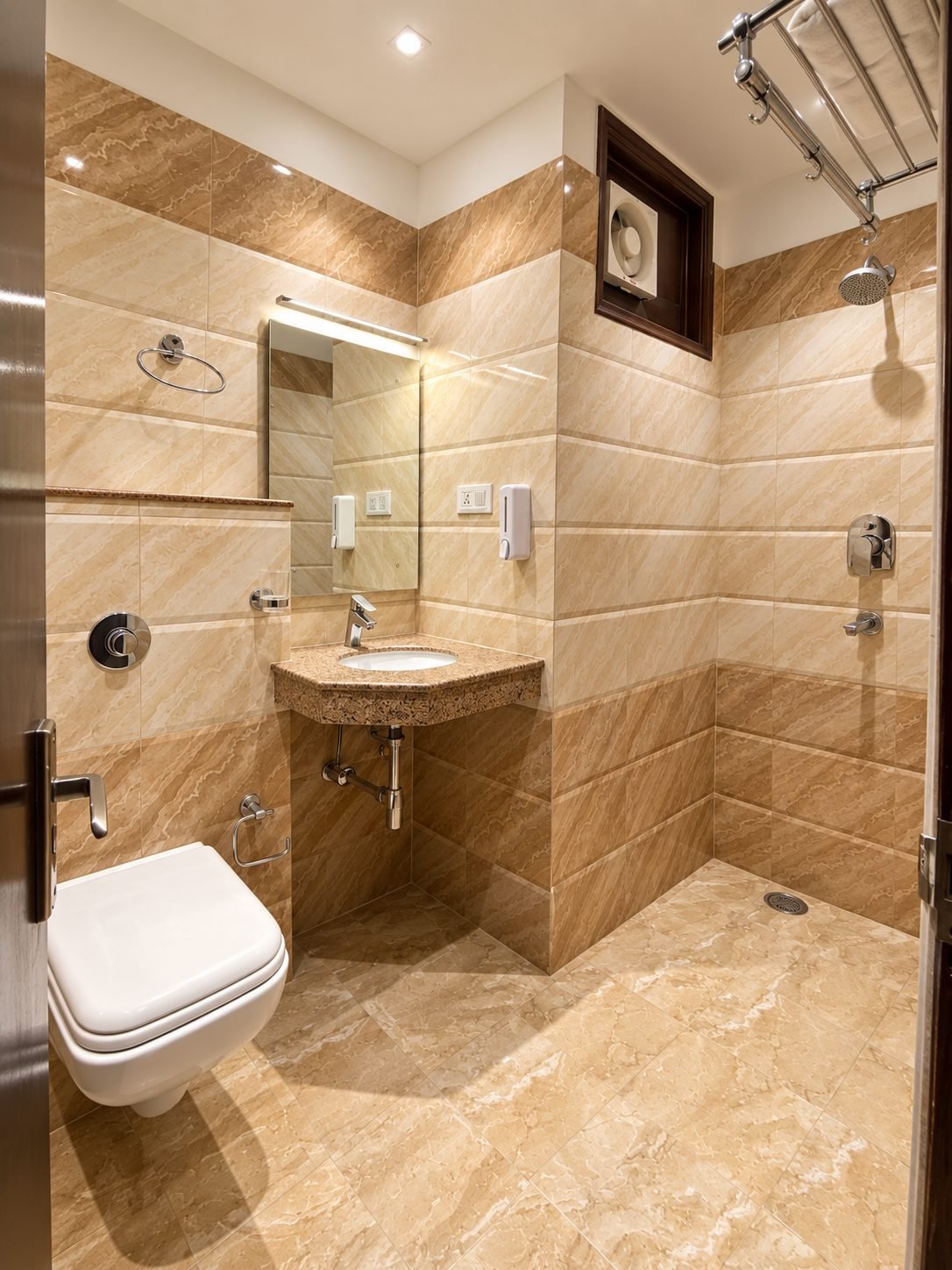 Standard room bathroom with beige stone-effect tiles, corner basin and rain shower